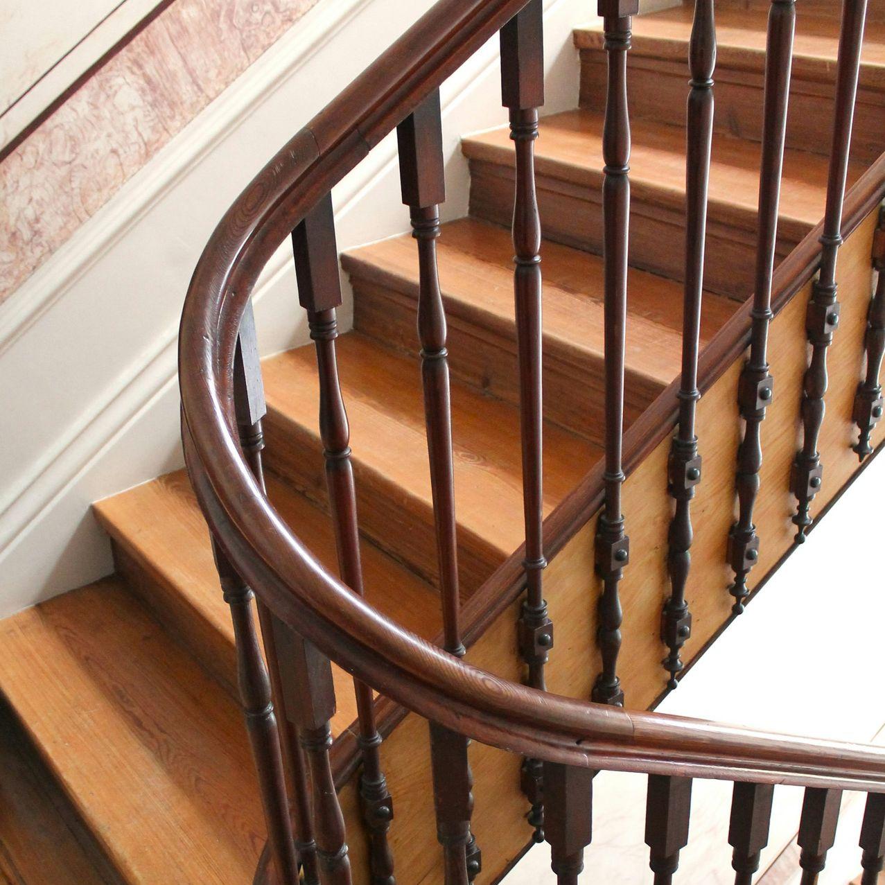 a wooden staircase with railings